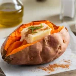 Perfectly baked sweet potato with crispy skin and fluffy interior.